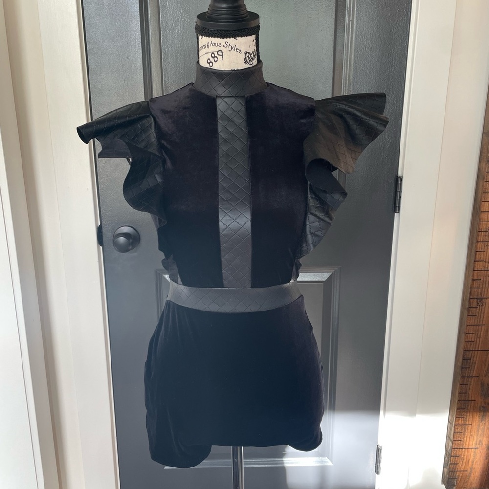 Black one piece costume with shorts
#004